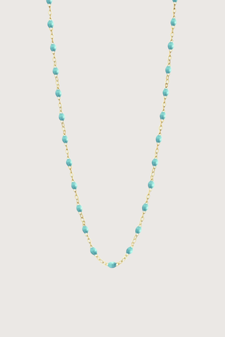 flat lay Classic Gigi Necklace 16.5" 18K Yellow Gold Lagoon Lagoon resin jewels
varying 16.5" options and solid black jewels
16.5" chain with adjustable clasp at 16.1"
