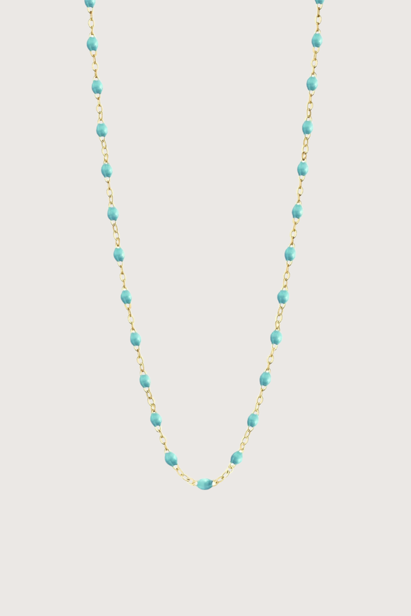 flat lay Classic Gigi Necklace 16.5" 18K Yellow Gold Lagoon Lagoon resin jewels
varying 16.5" options and solid black jewels
16.5" chain with adjustable clasp at 16.1"
