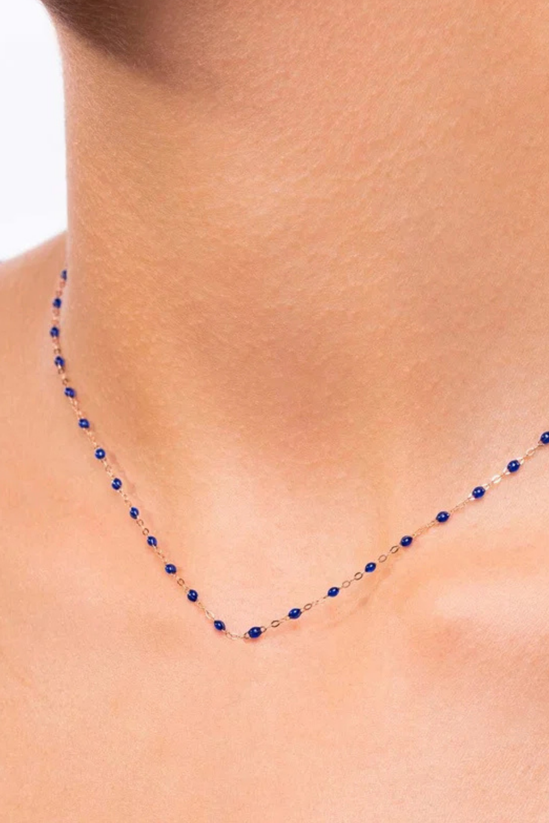model wearing  Classic Gigi Necklace 16.5" 18K Yellow Gold Lapis Lapis resin jewels
varying 16.5" options and solid black jewels
16.5" chain with adjustable clasp at 16.1"