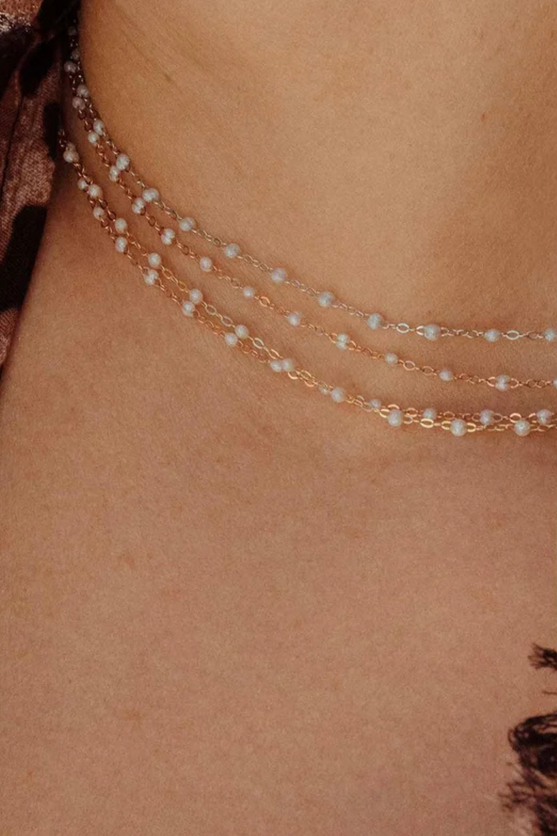 model wearing Classic Gigi Necklace 16.5" 18K Yellow Gold Opal Opal resin jewels
varying 16.5" options and solid black jewels
16.5" chain with adjustable clasp at 16.1"