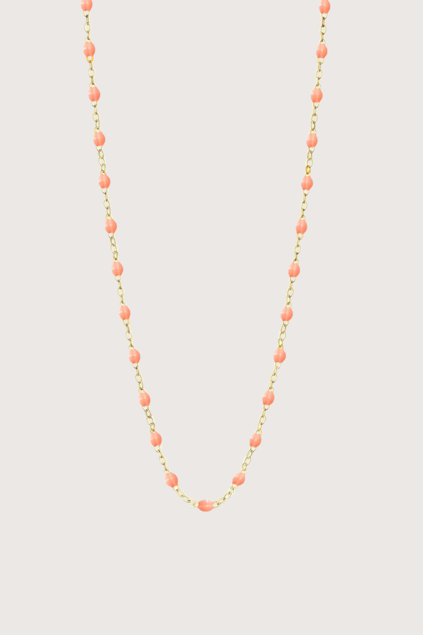 flat lay Classic Gigi Necklace 16.5" 18K Yellow Gold Salmon Salmon resin jewels
varying 16.5" options and solid black jewels
16.5" chain with adjustable clasp at 16.1"