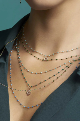 model wearing Classic Gigi Necklace 16.5" 18K Yellow Gold Scarab Scarab jewels
varying 16.5" options and solid black jewels
16.5" chain with adjustable clasp at 16.1"