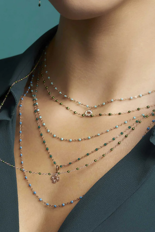 model wearing Classic Gigi Necklace 16.5" 18K Yellow Gold Scarab Scarab jewels
varying 16.5" options and solid black jewels
16.5" chain with adjustable clasp at 16.1"