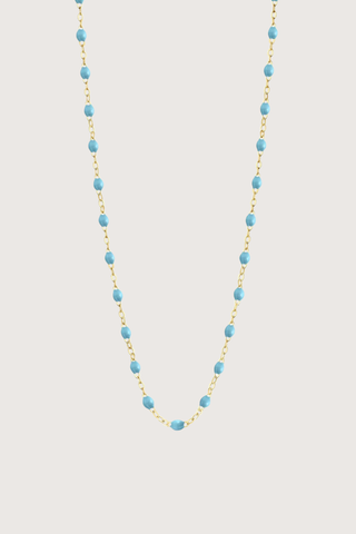 flat lay Classic Gigi Necklace 16.5" 18K Yellow Gold Turquoise Turquoise resin jewels
varying 16.5" options and solid black jewels
16.5" chain with adjustable clasp at 16.1"