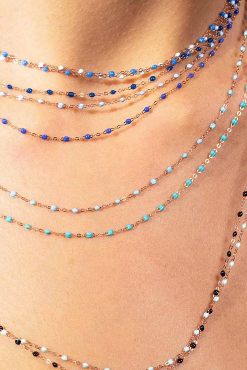 model wearing Classic Gigi Necklace 16.5" 18K Yellow Gold Turquoise Green Turquoise Green resin jewels
varying 16.5" options and solid black jewels
16.5" chain with adjustable clasp at 16.1"
