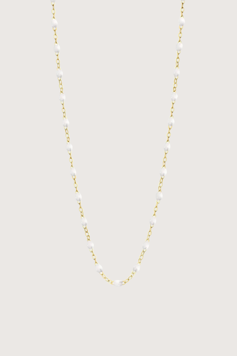 flat lay Classic Gigi Necklace 16.5" 18K Yellow Gold White White resin jewels
varying 16.5" options and solid black jewels
16.5" chain with adjustable clasp at 16.1"