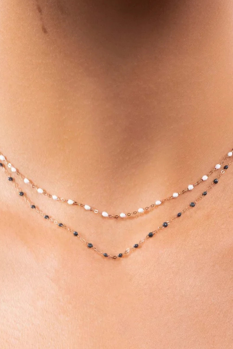 model wearing Classic Gigi Necklace 16.5" 18K Yellow Gold White White resin jewels
varying 16.5" options and solid black jewels
16.5" chain with adjustable clasp at 16.1"