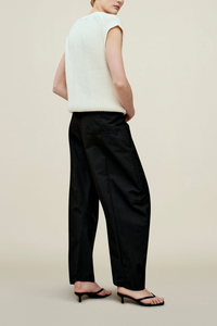 side profile model wearing Clemence Compact Cotton horseshoe Pant black with adjustale drawstring and pleats