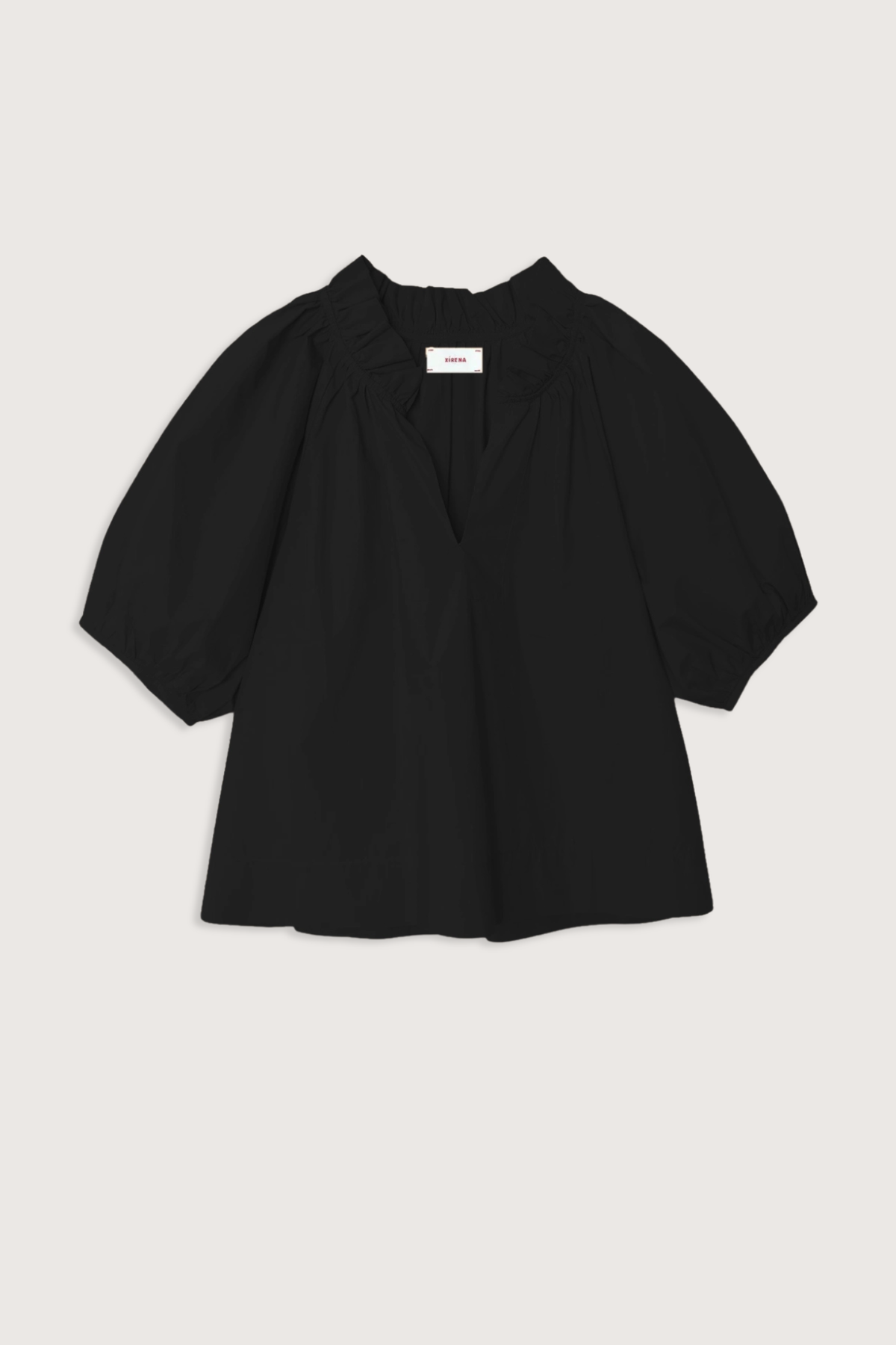 flat lay Clementine Top black Crisp paper poplin
Deep V-neck
Ruffle detailing
Shirred puff sleeves
100% Cotton