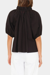back profile model wearing Clementine Top black Crisp paper poplin
Deep V-neck
Ruffle detailing
Shirred puff sleeves
100% Cotton