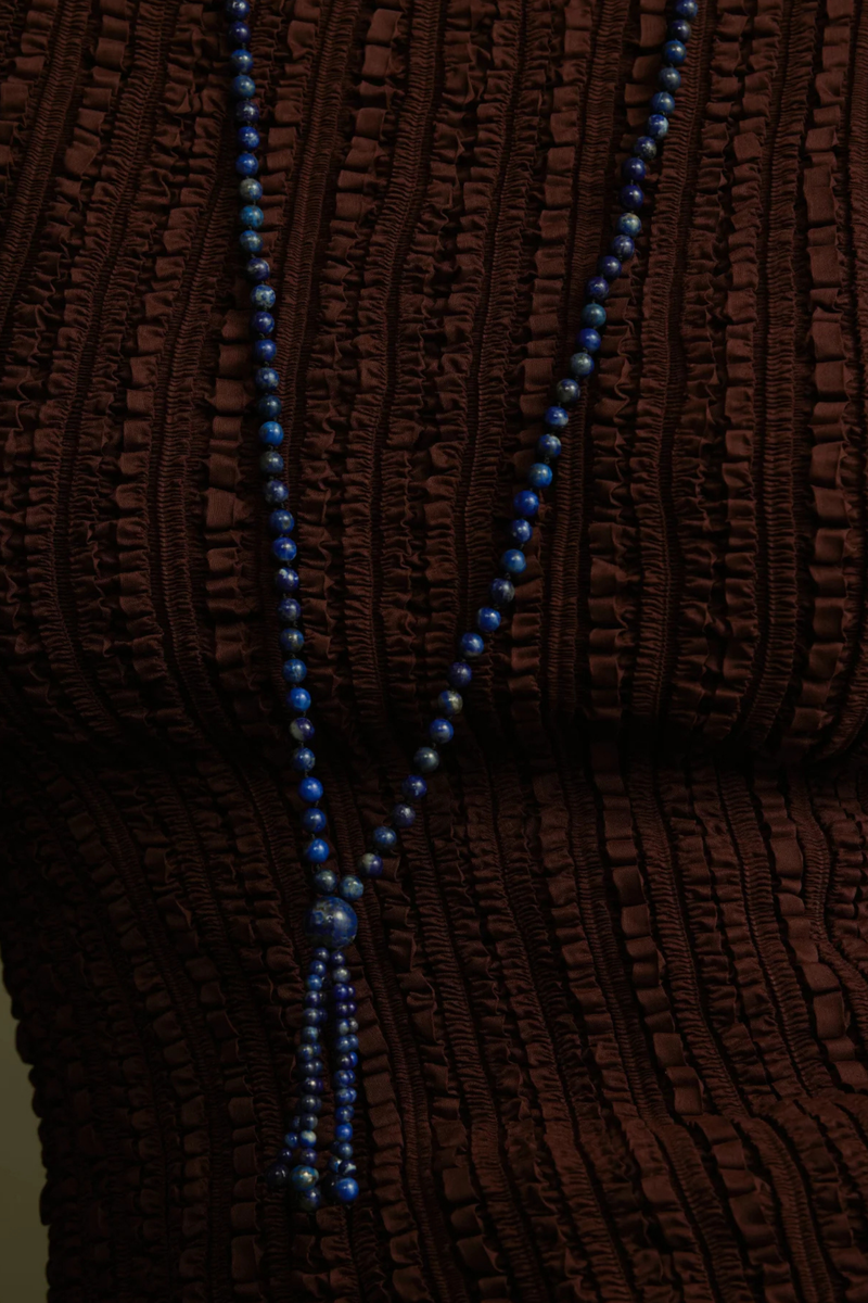 model wearing Cobalt Tassel Necklace Round blue lapis beads
Softly draped tassel
Can be worn long or layered
Necklace length 80cm
Tassel length 10cm