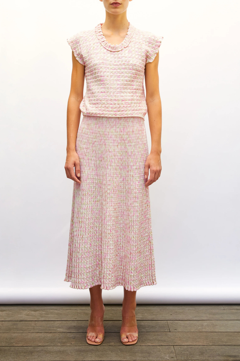 front profile model wearing  Cocktail Fluid Skirt natural pink combo Fine knit skirt
Fluid cut
Luminous finish
Blend of extra-soft wool and printed rayon yarns
Wide, striped knit waistband
Origami knit