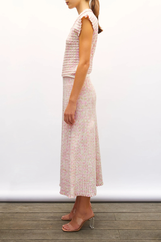 side profile model wearing  Cocktail Fluid Skirt natural pink combo Fine knit skirt
Fluid cut
Luminous finish
Blend of extra-soft wool and printed rayon yarns
Wide, striped knit waistband
Origami knit