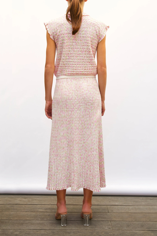 back profile model wearing  Cocktail Fluid Skirt natural pink combo Fine knit skirt
Fluid cut
Luminous finish
Blend of extra-soft wool and printed rayon yarns
Wide, striped knit waistband
Origami knit