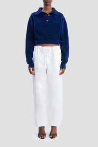 front profile model wearing Collared Cropped Top bright navy Chenille knit
Rib cuffs
Knitted collar with buttons
Back neck VB logo embroidery
