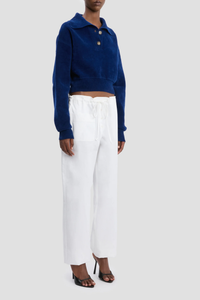 side profile model wearing Collared Cropped Top bright navy Chenille knit
Rib cuffs
Knitted collar with buttons
Back neck VB logo embroidery