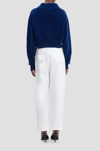 back profile model wearing Collared Cropped Top bright navy Chenille knit
Rib cuffs
Knitted collar with buttons
Back neck VB logo embroidery