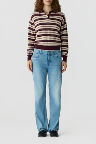 front profile model wearing Collegiate Stripe Polo fig combo 
Knit from light-weight 100% cashmere
Relaxed fit
Rib hem and cuff trim
Polo collar in rib stitch
Front three button placket closure