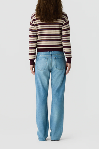 back profile model wearing Collegiate Stripe Polo fig combo 
Knit from light-weight 100% cashmere
Relaxed fit
Rib hem and cuff trim
Polo collar in rib stitch
Front three button placket closure
