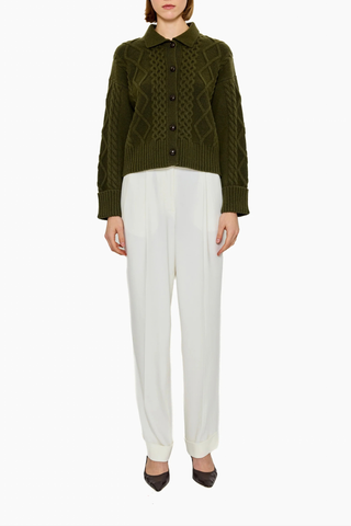 front profile model wearing Columbia Cable Cardigan Olive 100% cashmere
Richly textured cable knit
Leatherette button
Dense, intricate structure&nbsp;
GOTS certified cashmere
Dark Olive
Heavyweight