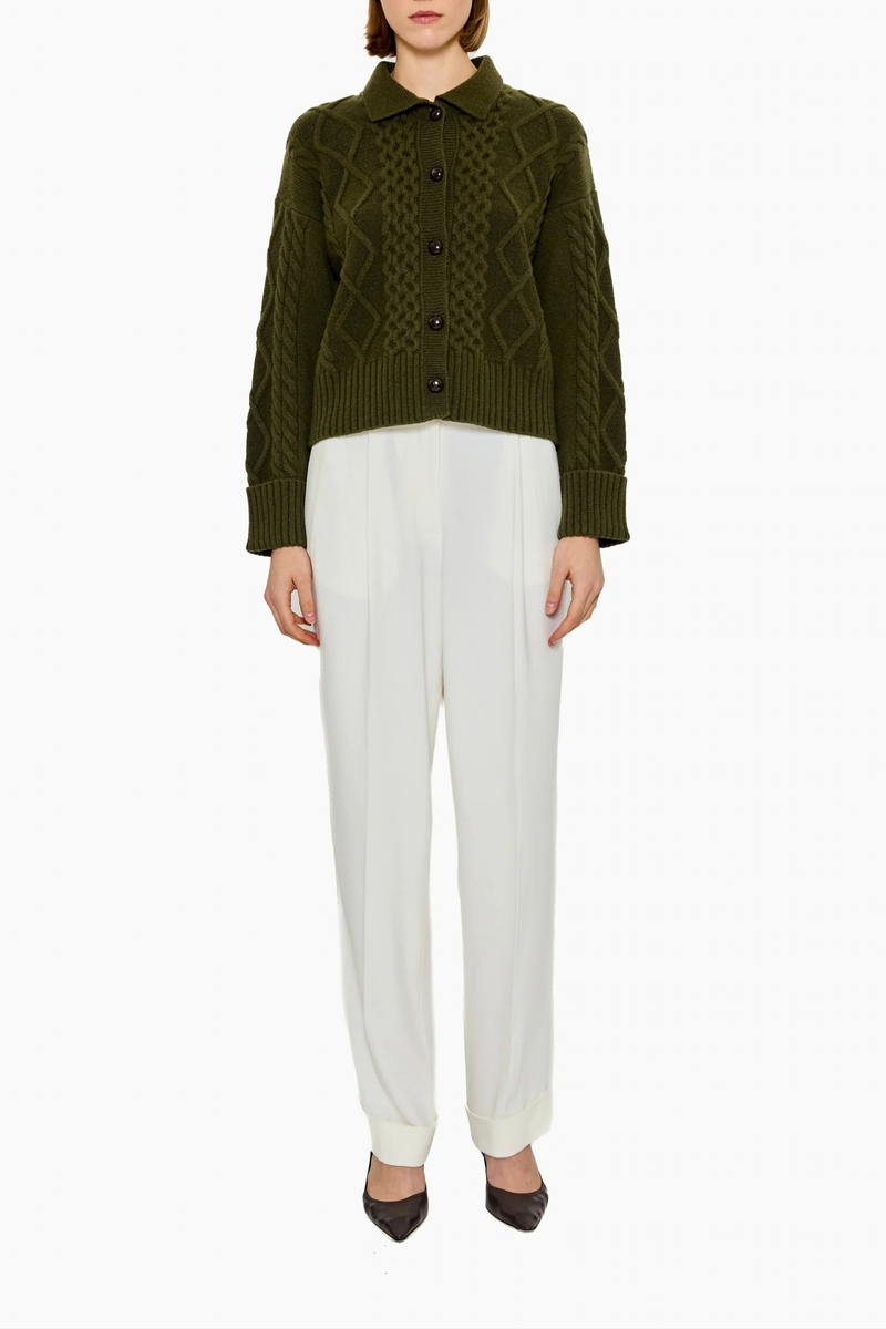 front profile model wearing Columbia Cable Cardigan Olive 100% cashmere
Richly textured cable knit
Leatherette button
Dense, intricate structure&nbsp;
GOTS certified cashmere
Dark Olive
Heavyweight
