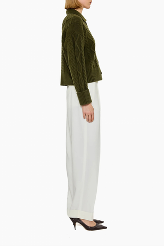side profile model wearing Columbia Cable Cardigan Olive 100% cashmere
Richly textured cable knit
Leatherette button
Dense, intricate structure&nbsp;
GOTS certified cashmere
Dark Olive
Heavyweight