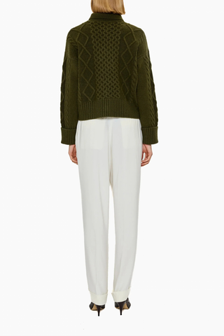 back profile model wearing Columbia Cable Cardigan Olive 100% cashmere
Richly textured cable knit
Leatherette button
Dense, intricate structure&nbsp;
GOTS certified cashmere
Dark Olive
Heavyweight