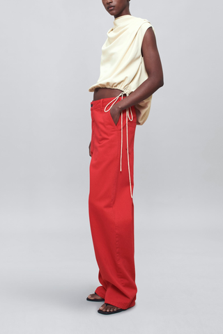 side profile model wearing Column Leg Jeans red Wide Leg
Red cotton denim
Mid-high rise
Relaxed through hip and thigh
Subtle sculptural curve
Deep side seam slant pockets and back pockets
Belt loops