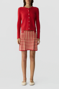 front profile model wearing Compass Jane Cardigan scarlet red LIGHT-WEIGHT POPCORN STITCH CARDIGAN
HIGH CUFF RIB TRIM AT SLEEVE
RIB HEM TRIM
JERSEY TUBULAR NECK TRIM
FRONT BUTTON CLOSURE
GIR BRANDING AT BACK NECK
100% CASHMERE