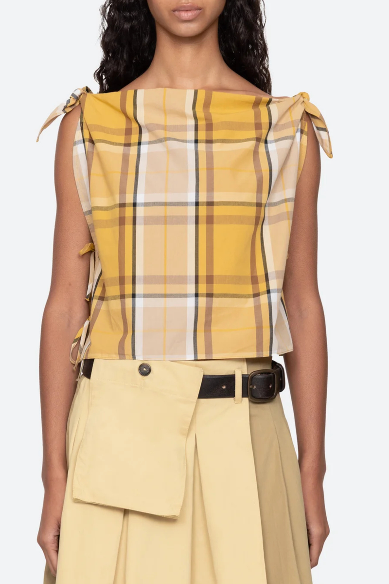 front profile model wearing  Copeland Top yellow plaid cotton Plaid pattern top
Relaxed
Slightly cropped silhouette
Ties at the shoulders and sides