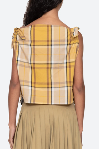 back profile model wearing  Copeland Top yellow plaid cotton Plaid pattern top
Relaxed
Slightly cropped silhouette
Ties at the shoulders and sides