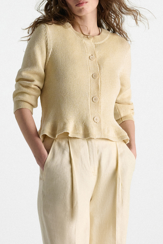 front profile model wearing Cotton Candy Cardigan icy lemon yellow Fun flounce effect at the hemline
100 % Cotton
Cropped
Button front
Flared drape
Round neckline