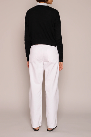 back profile model wearing Cotton/Cashmere Crop Cardigan Black 4-button cardigan
V neckline
Cropped wide
Boxy fit
Ribbed trim cuff &amp; hem
Waist-length
Side 2 side slits