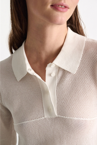 close up detail model wearing Cotton Coolness Mesh Top white Knit top with polo collar and empire waist
Sporty stretch cotton pointelle
A special engineered knit technique creates flared volume from the empire seam to hem