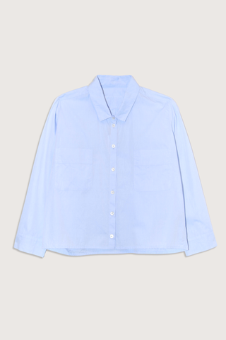 flat lay Cotton Crop Shirt With Pockets  Light Blue
Front chest pocket
Button front closure
Classic collar
