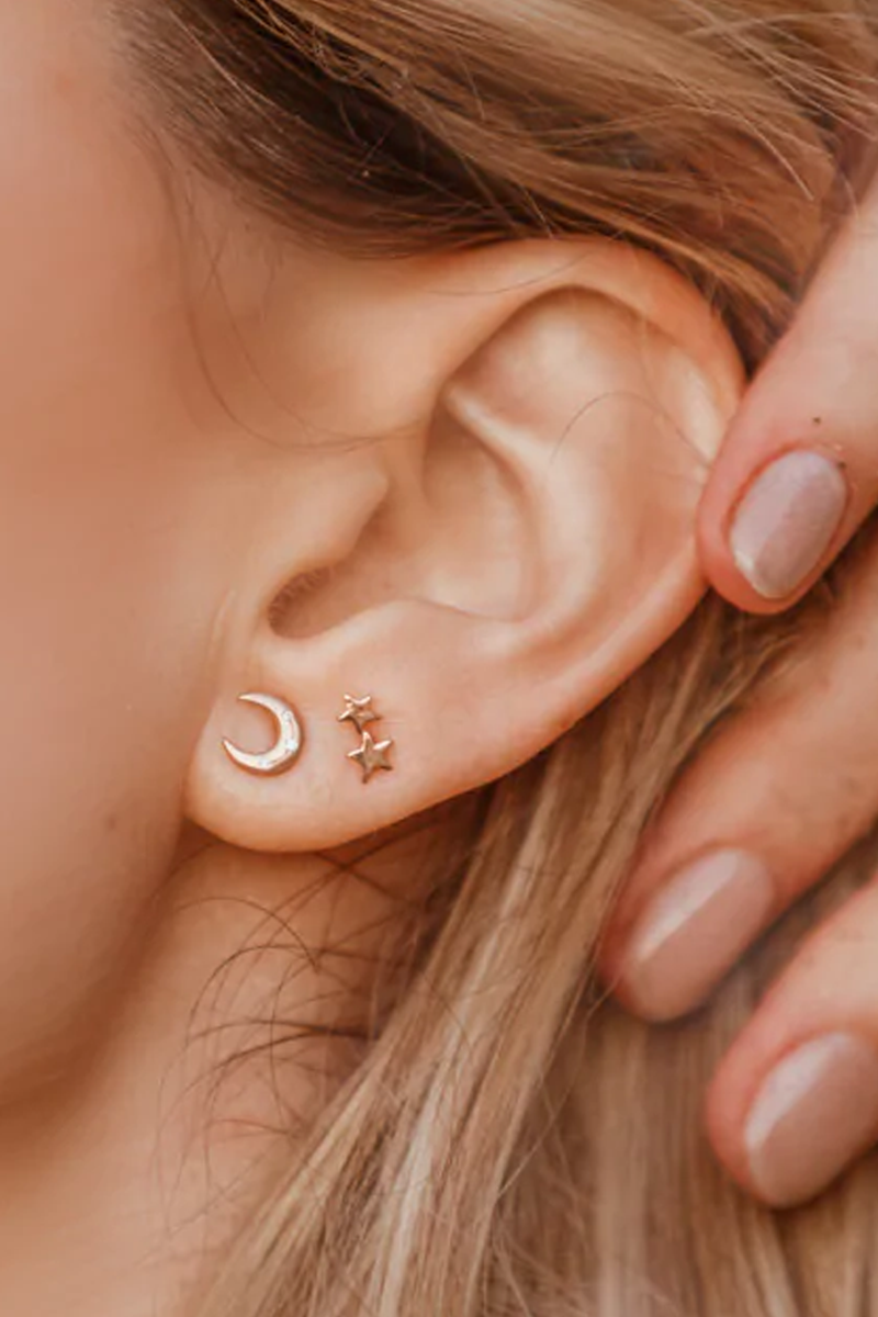 model wearing Crescent Disc Earring in Rose Gold with solid 14k gold and diamonds