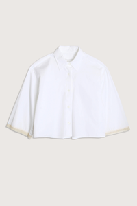 flat lay Cropped Lace Shirt white delicate, ivory French lace detail at the cuff
Shorter, cropped length
Center box pleat at the back
Wide, short sleeves
Organic Cotton sateen
