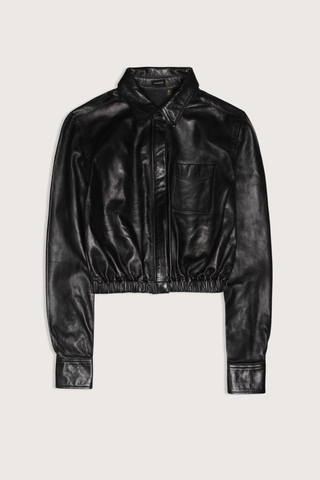 flat lay Cropped Leather Boxy Shirt black Classic collar
Cropped fit
Elasticated waist
Chest pocket
Top and bottom snap buttons
Hidden traditional button closure for middle buttons
100% Italian lamb leather