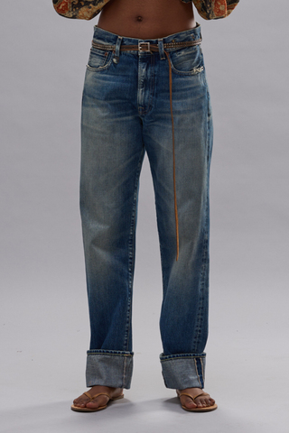 front profile model wearing Cuffed BF Jean Abyss selvedge blue Italian selvedge denim