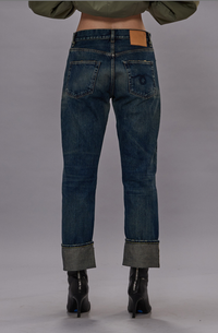 back profile model wearing Cuffed Boyfriend Selvedge Jean straight fit blue wash