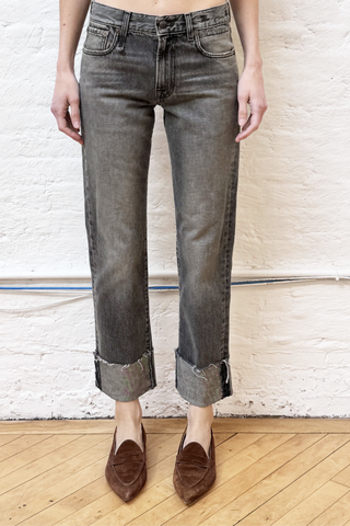front profile model wearing  Cuffed Romeo Jean Leyton Black Mid-rise
Slim-straight leg jean
Made with Italian denim (100% Cotton)
Black wash
Mild wear pattern