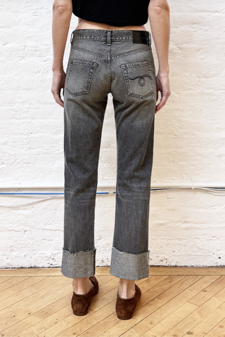 back profile model wearing  Cuffed Romeo Jean Leyton Black Mid-rise
Slim-straight leg jean
Made with Italian denim (100% Cotton)
Black wash
Mild wear pattern