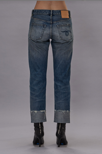 back profile model wearing Cuffed Romeo Selvedge Jean slim straight blue wash