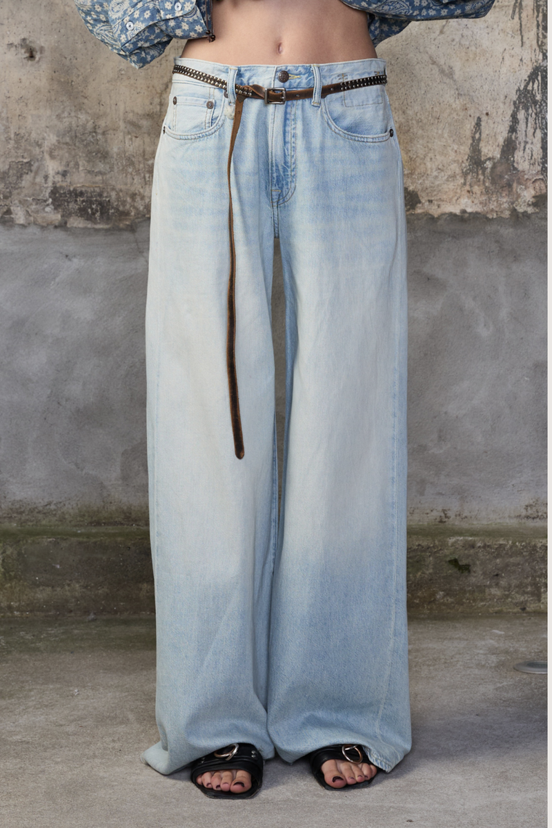 front profile model wearing  D'arcy Flare Jean lenon blue ight wash Relaxed wide leg
5 pocket jean
Flared leg
Japanese Rigid indigo denim cotton