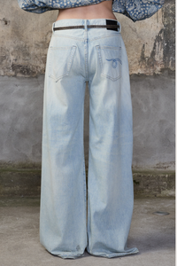 back profile model wearing  D'arcy Flare Jean lenon blue ight wash Relaxed wide leg
5 pocket jean
Flared leg
Japanese Rigid indigo denim cotton