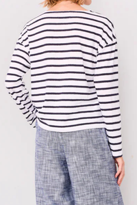 back profile model wearing Dakota Long Sleeve Stripe Tee navy white stripe Slightly loose fitted long-sleeved tee-shirt.
Boat neck
Large crew-neck