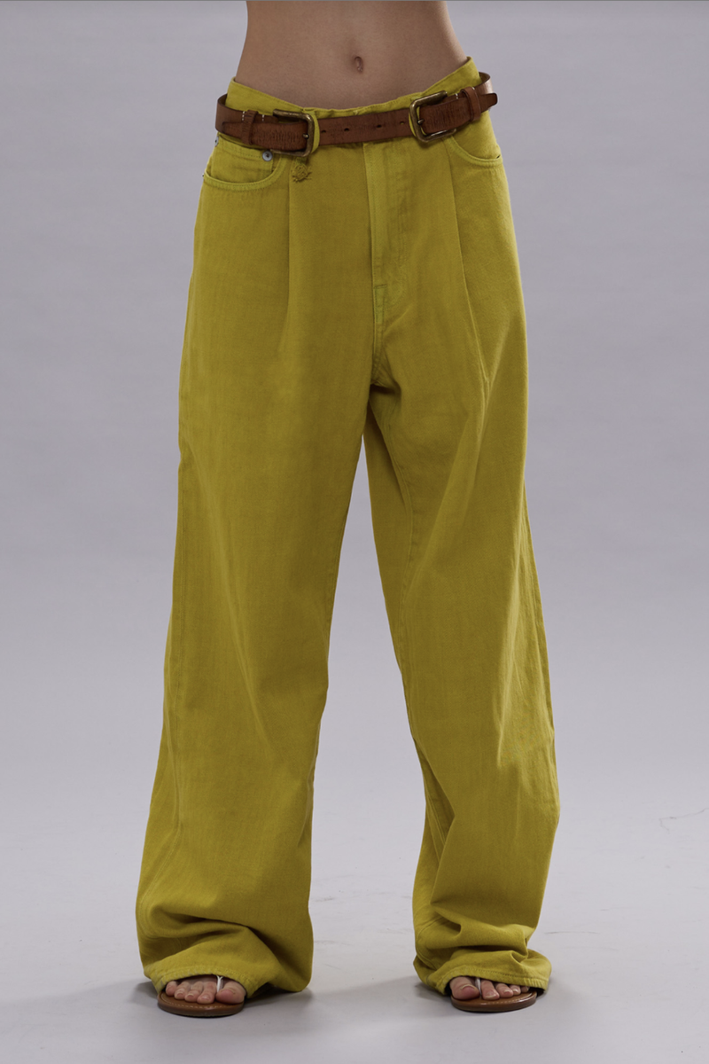 front profile model wearing Pleated Wide leg jean
Yellow bleack/overdye Japanese indigo denim. 13oz