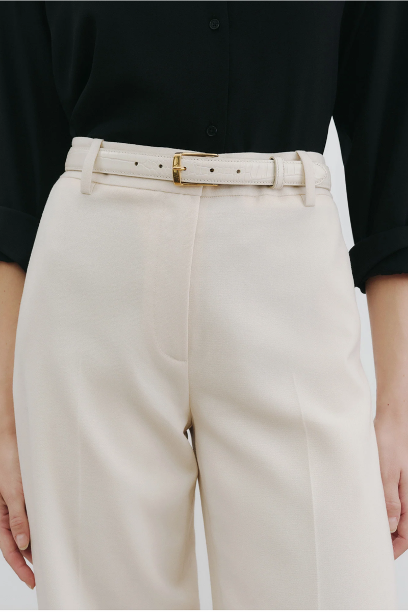 front profile model wearing Dana Belt Ivory/Gold 25mm wide belt
Embossed croc
Italian leather
Leather keeper
Custom gold hardware finish
Italian hardware with engraved logo on the back
Lined in black contrasting leather