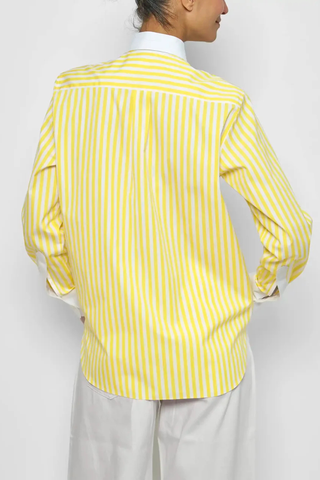 back profile model wearing Dandy Shirt yellow white vertical stripe Exaggerated white curved collar set against bright yellow striped cotton poplin
Straight cut - classic fit
Back yoke with pleat
Round collar
Rounded cuff
Mother-of-pearl buttons
Medium weight cotton
100% two-ply cotton poplin woven in Italy