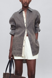 front profile model wearing Dani Stripe Shirt graphite Classic oversized
Button down
Soft linen stripe
Classic shirt buttons
Tonal grosgrain placket detail